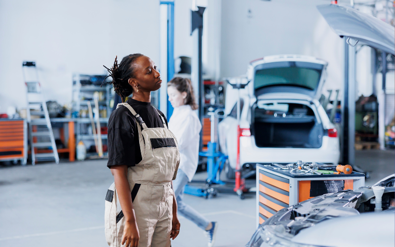 Mechanic looking at car