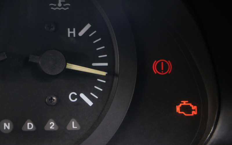 Close-up of a car driver's display showing brake system warning light